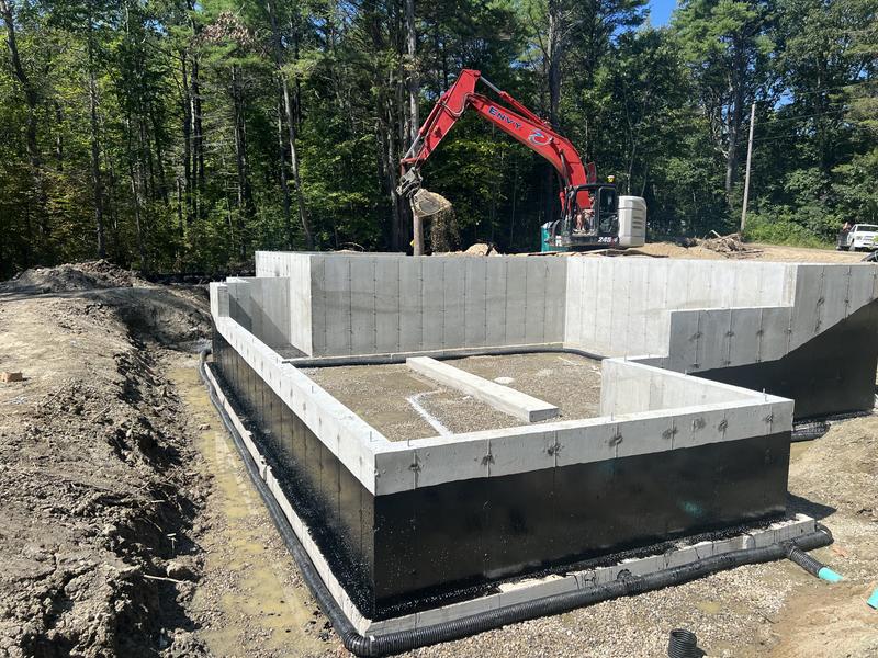 CAT excavator digging a foundation