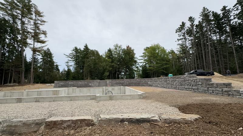 Granite retaining wall by Envy Excavation
