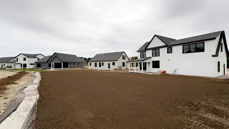 Topsoil placement and rough grading by Envy
