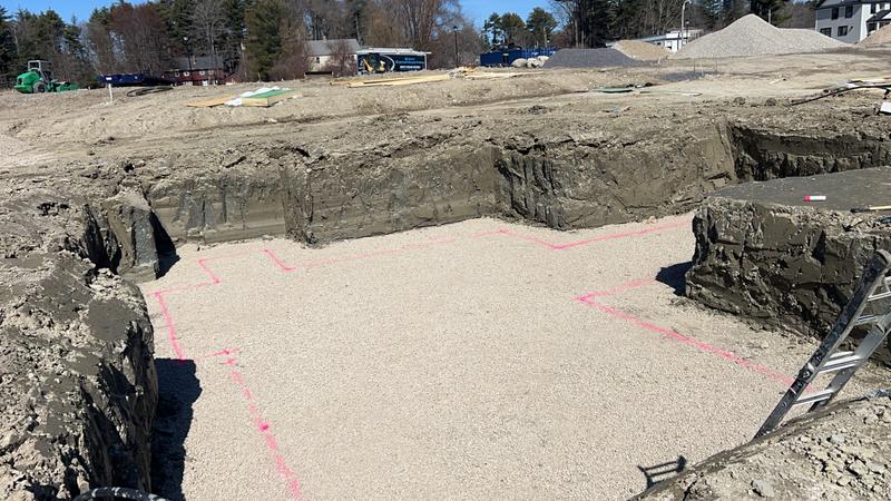 Excavator preparing a foundation site