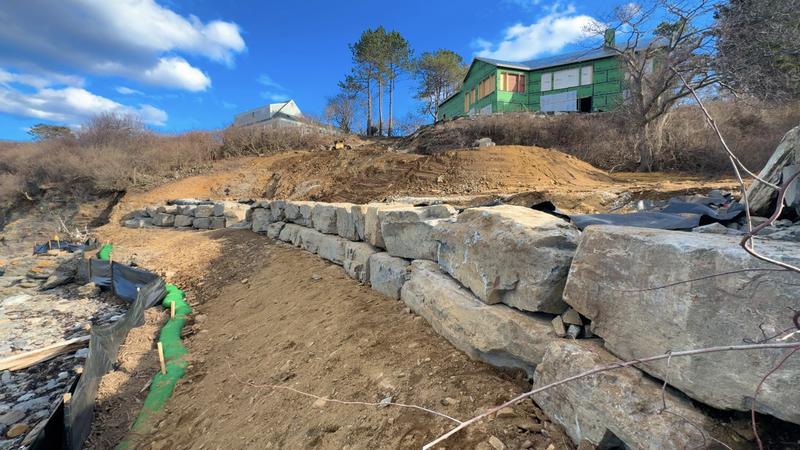 Granite retaining wall by Envy Excavation