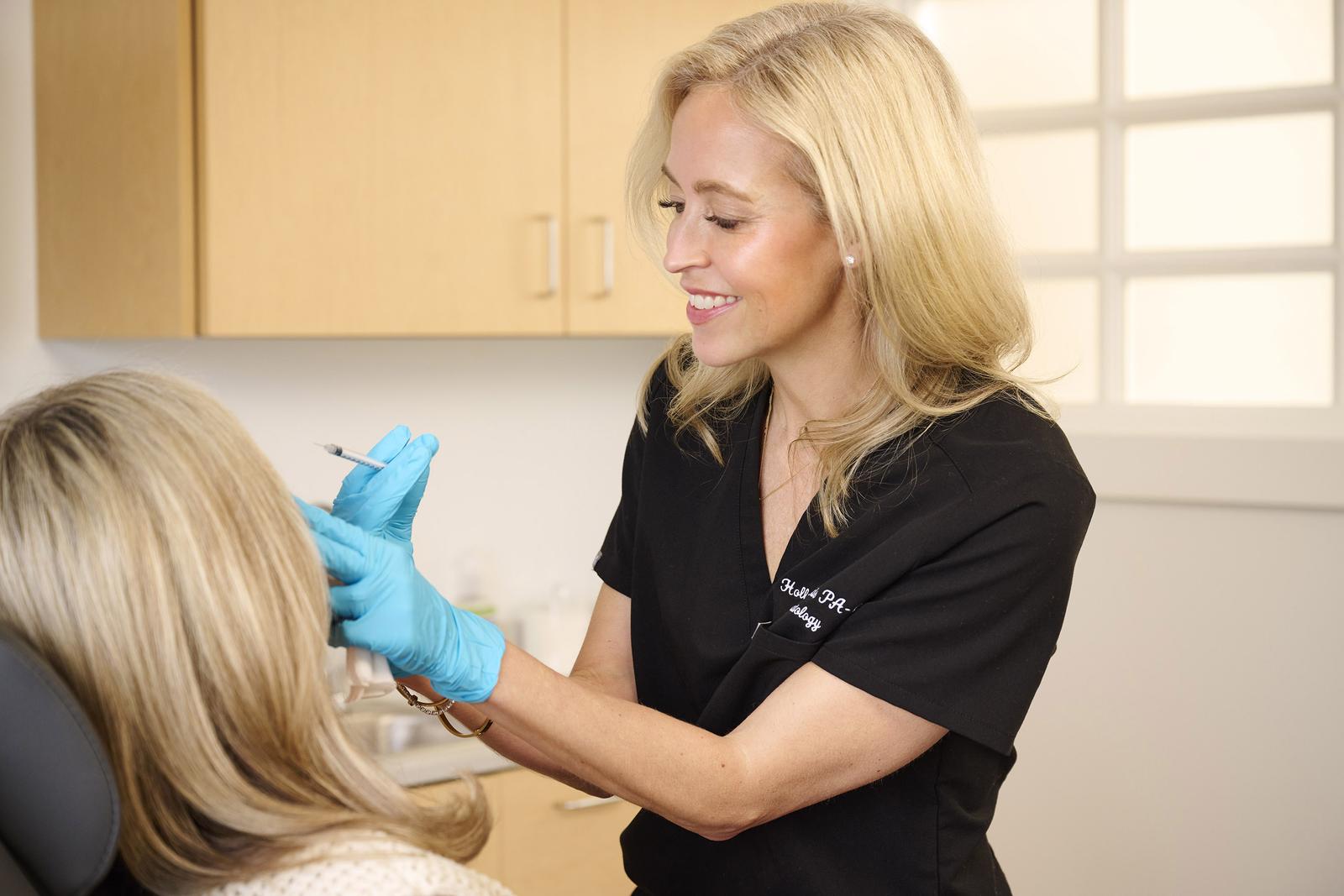 Holly Morris, PA-C, performing an aesthetic treatment at TruForm