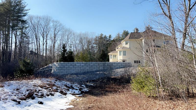 Granite retaining wall by Envy Excavation