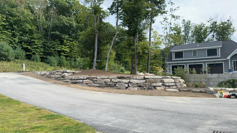 Granite retaining wall by Envy Excavation