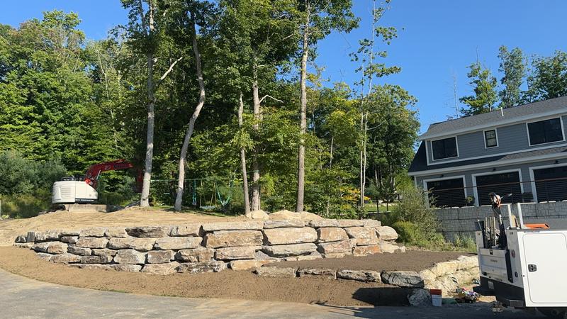 Granite retaining wall by Envy Excavation