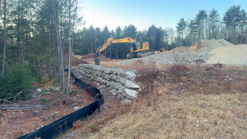 Granite retaining wall by Envy Excavation