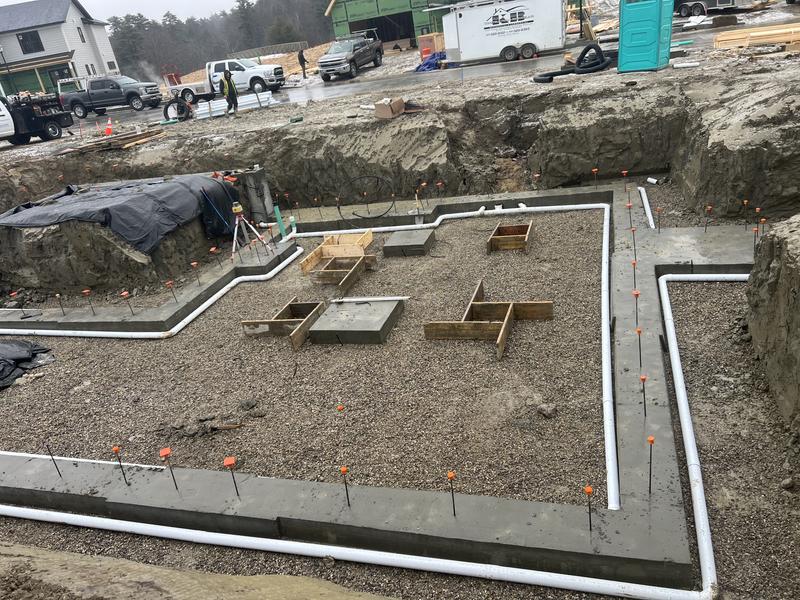 Excavator preparing a foundation site